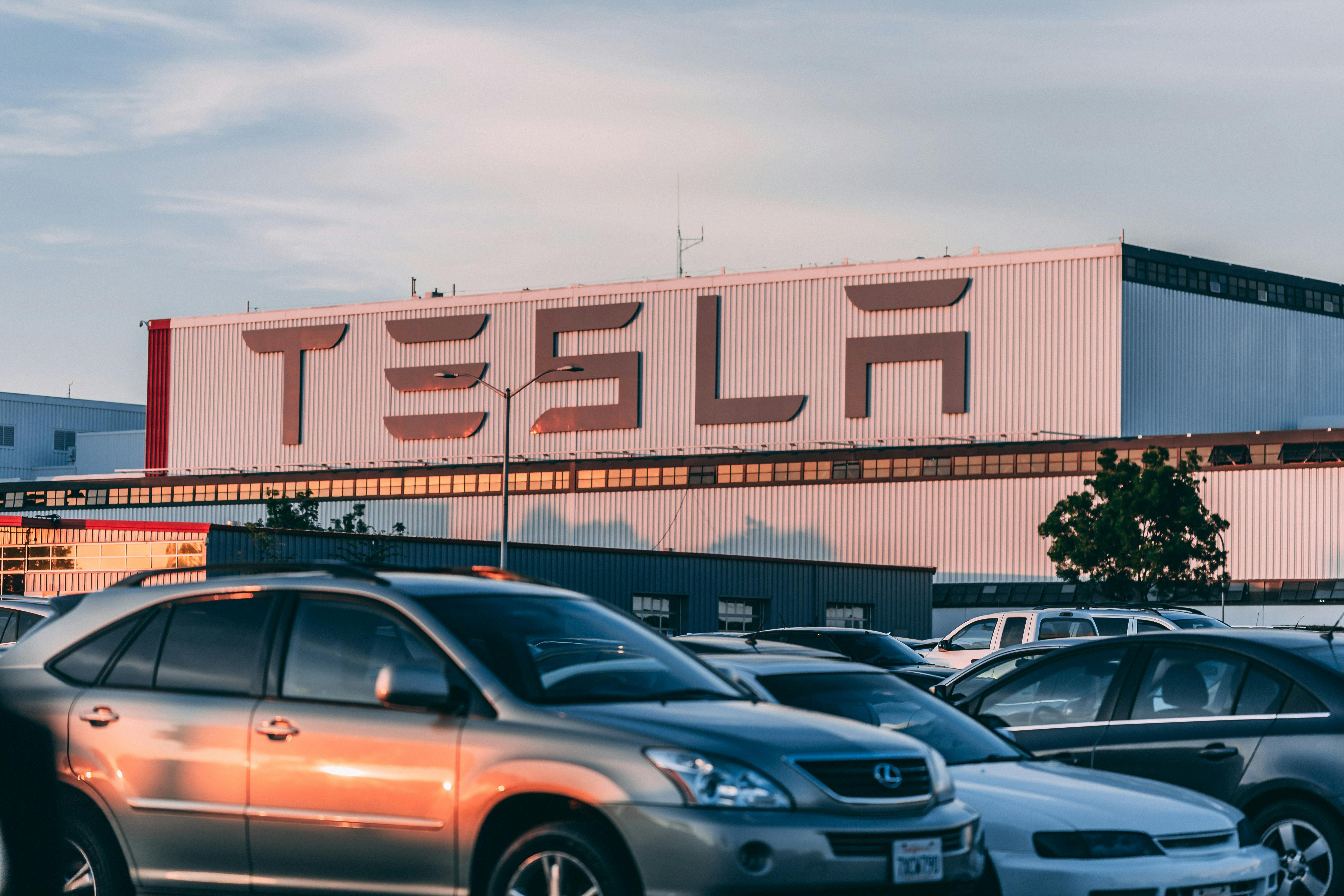 Cars parked infront of Tesla building