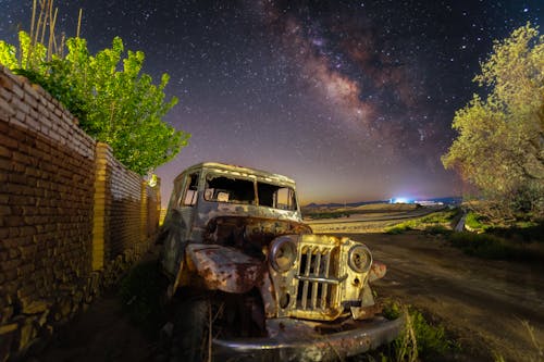 Milky way over abandon car
