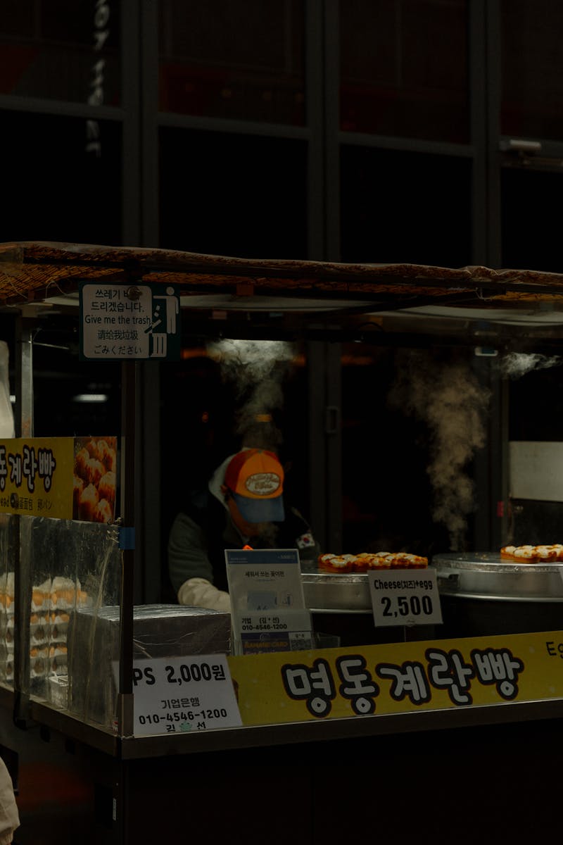 Steaming street food stall in Seoul's market at night