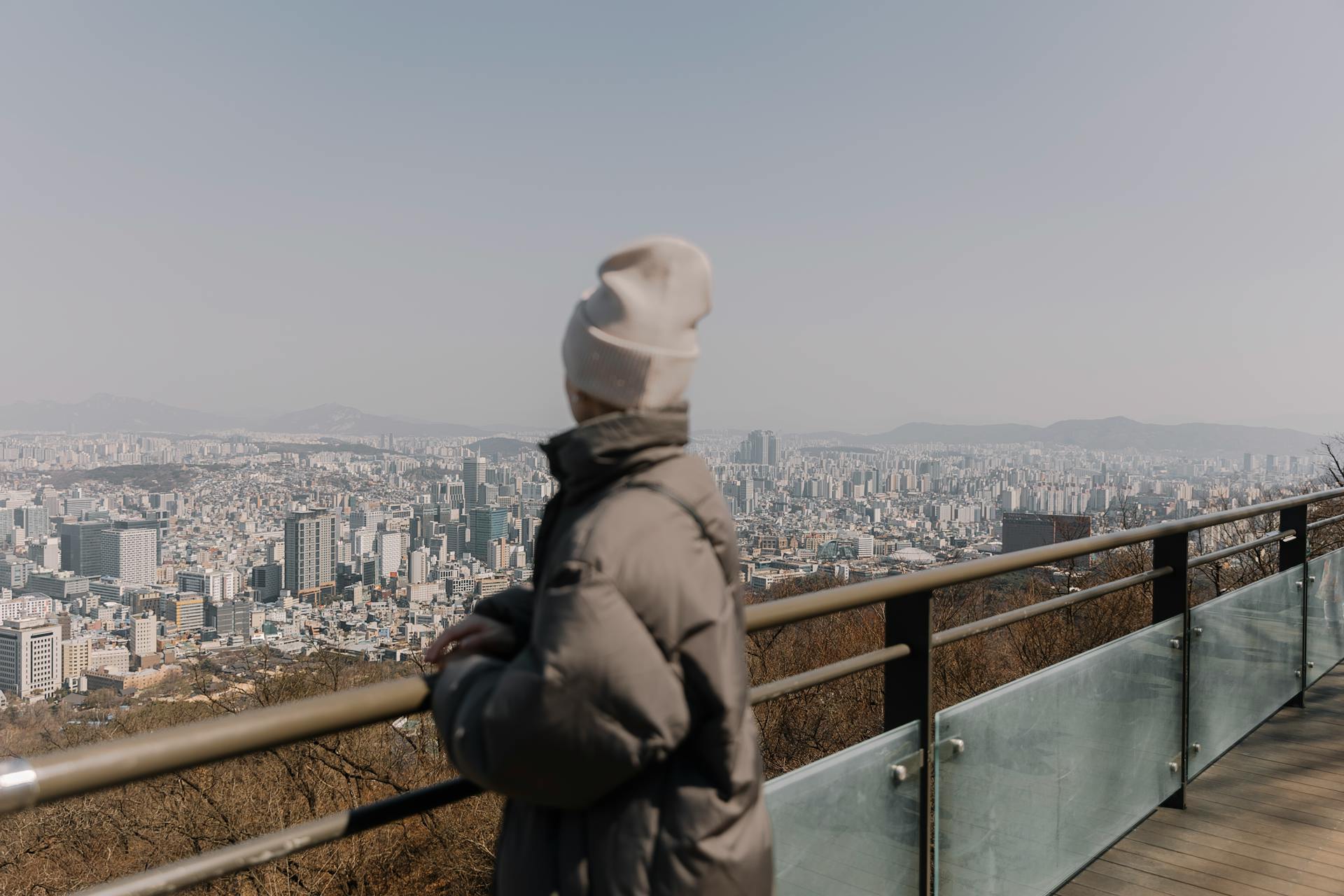 A Woman Standing on an Observation Deck and Looking at the Cityscape of Seoul, South Korea