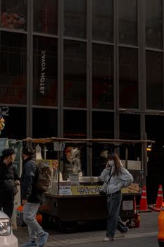 Captivating street market scene with pedestrians in an urban setting, showcasing local culture.
