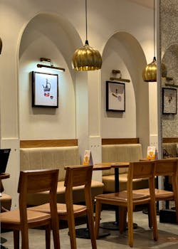 A chic and modern restaurant interior showcasing elegant furniture and lighting in Bengaluru, India.