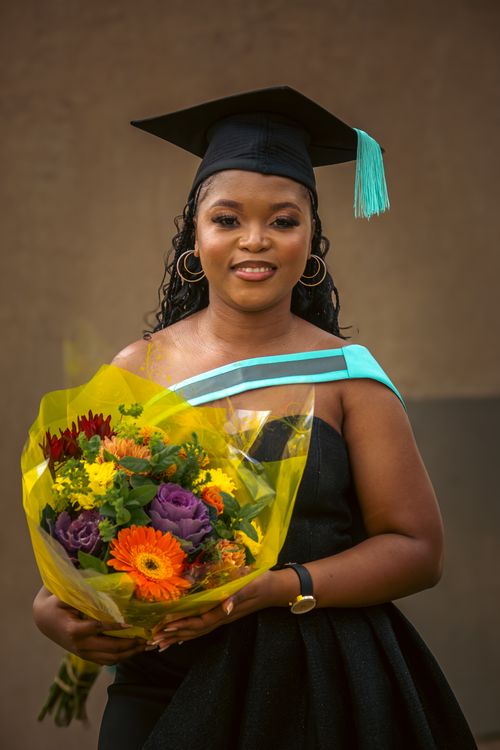 Beautiful Spring Graduation Beautiful Woman at Graduation Smiling and Holding a Bouquet of Flowers ...