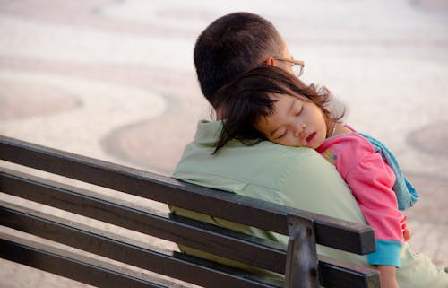 Free Baby's Sleeping on a Man's Shoulder Stock Photo