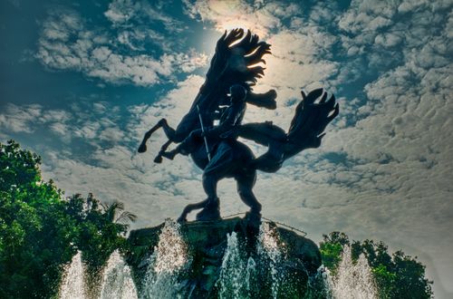 Free Silhouette of Arjuna Wijaya Statue in Jakarta against a vibrant sky, showcasing cultural artistry and outdoor beauty. Stock Photo