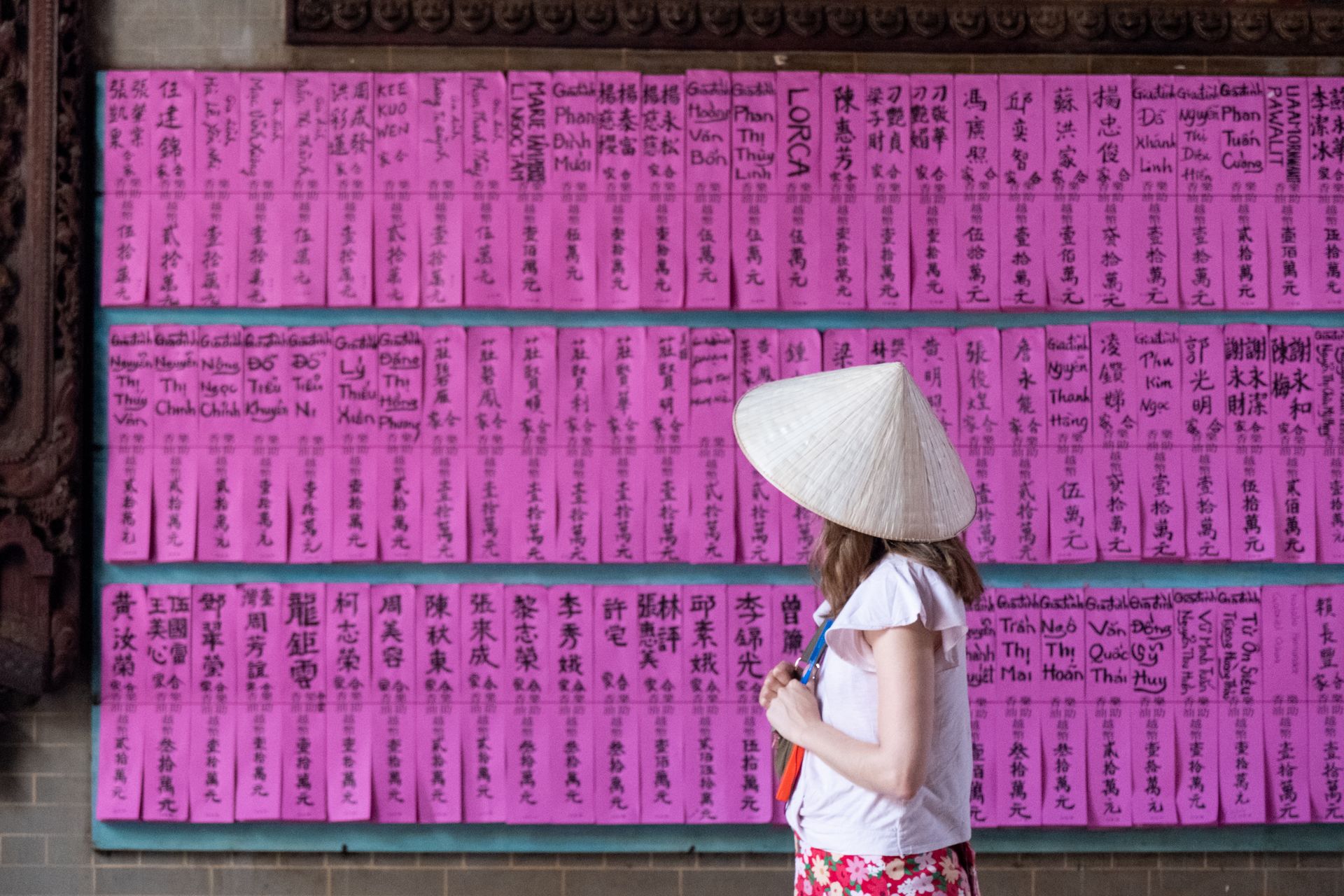 Pink Paper Slips Listing Donors at the Chua Ba Thien Hau Temple