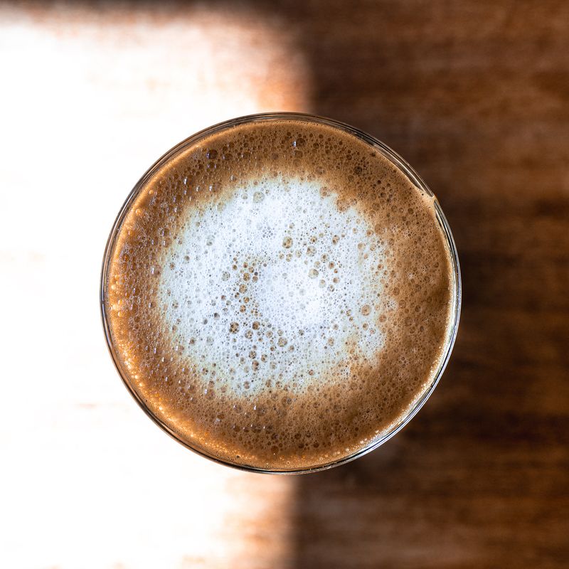 Latte seen from above with foam — photo by Jakub Zerdzicki on Pexels