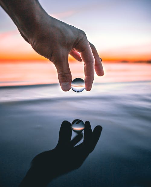 Free Clear Ball Above Body of Water Stock Photo