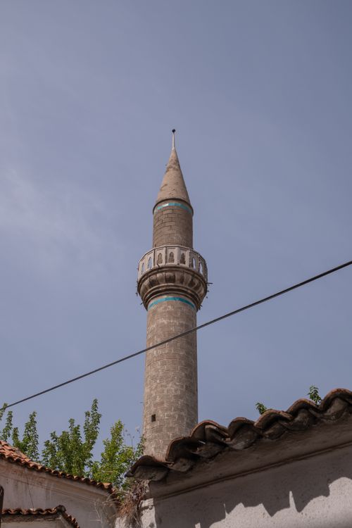Free Vertical shot of a historic minaret against a clear sky in İzmir, Türkiye, showcasing Islamic architecture. Stock Photo