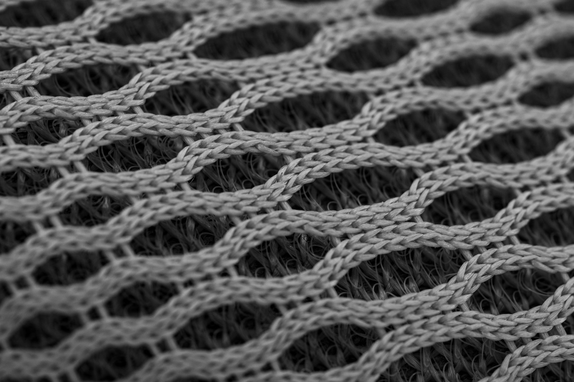 Side-by-side close-up of a dense ponte double knit and a loosely constructed woven fabric, illustrating how structural density affects the distribution and release of compression stress that causes wrinkle setSOURCE: Unsplash