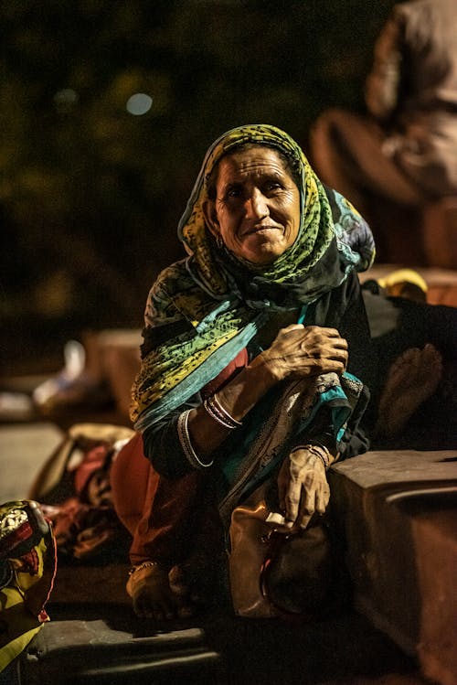 Selective Focus Photo of Woman Wearing Multicolored headscarf