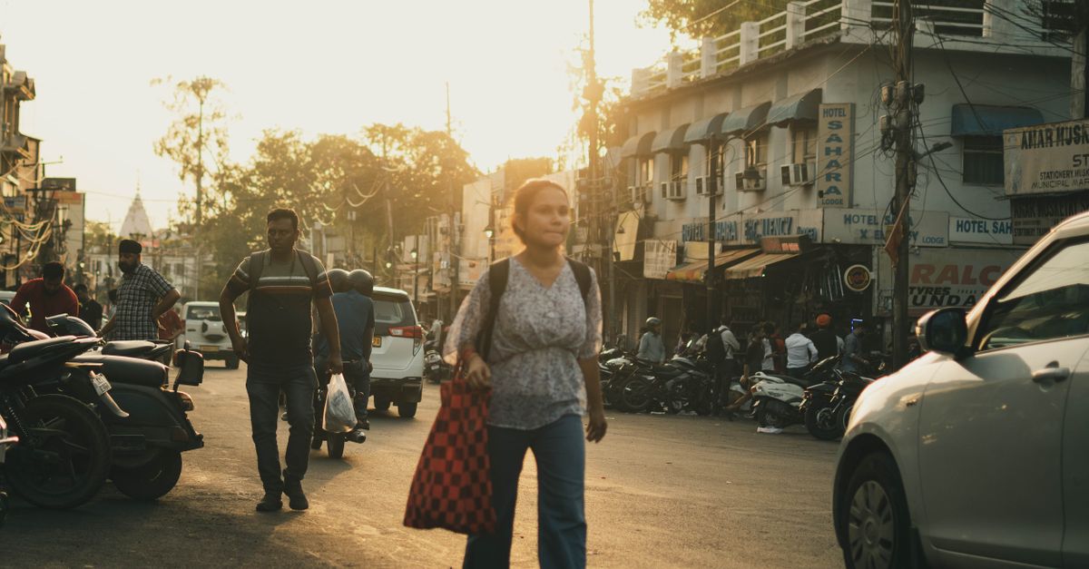 woman walking outdoors morning sunlight neighborhood