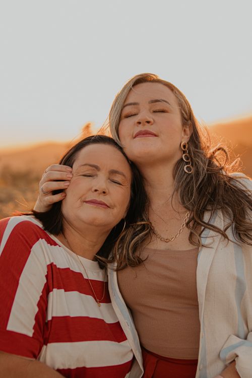 Free A heartfelt moment of mother and daughter enjoying a sunset embrace in São Paulo. Stock Photo