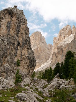 Captivating rocky landscape in Selva di Val Gardena, Dolomites, Italy featuring towering peaks and lush greenery.