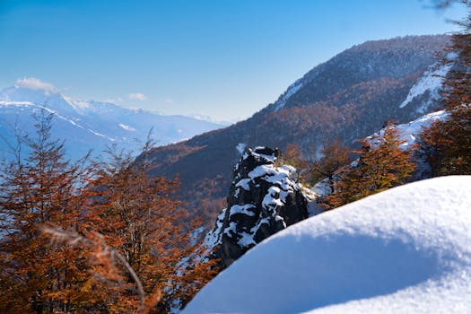 Discover the stunning snow-covered landscapes of El Bolsón, Argentina in this autumn mountainside view.