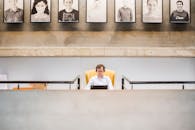 Person Sitting on Yellow Chair