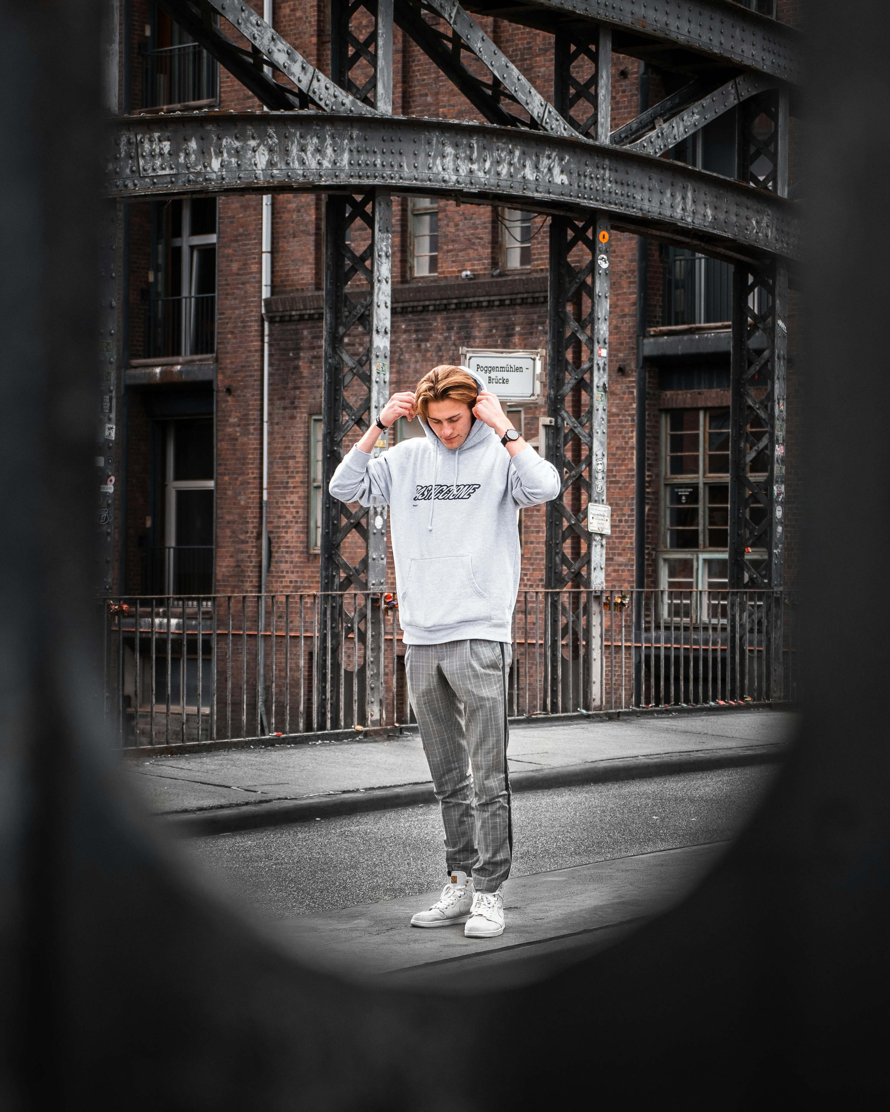 Selective focus photography of person wearing LA Dodgers cap