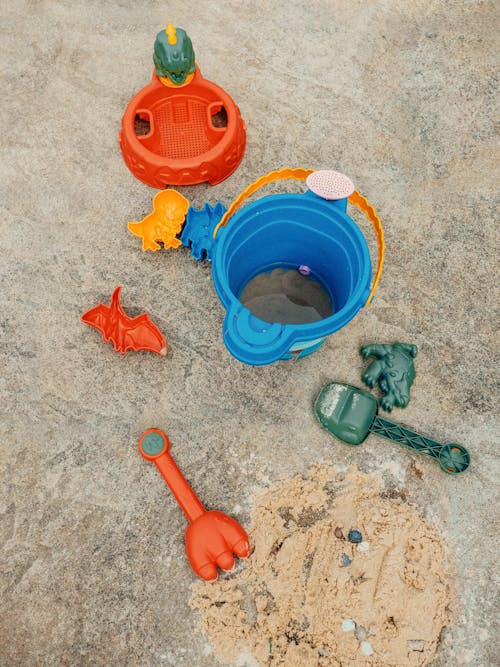 Foto profissional grátis de areia, balde, brincar