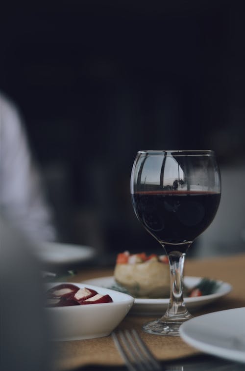 Free Selective Focus Photo of Red Wine in Wine Glass  Stock Photo