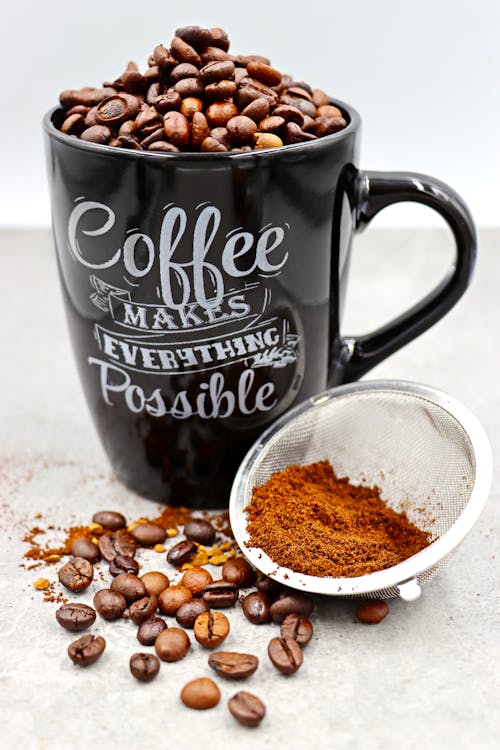 Coffee Inspirational Quote on Black Mug with Coffee Beans  and Powder