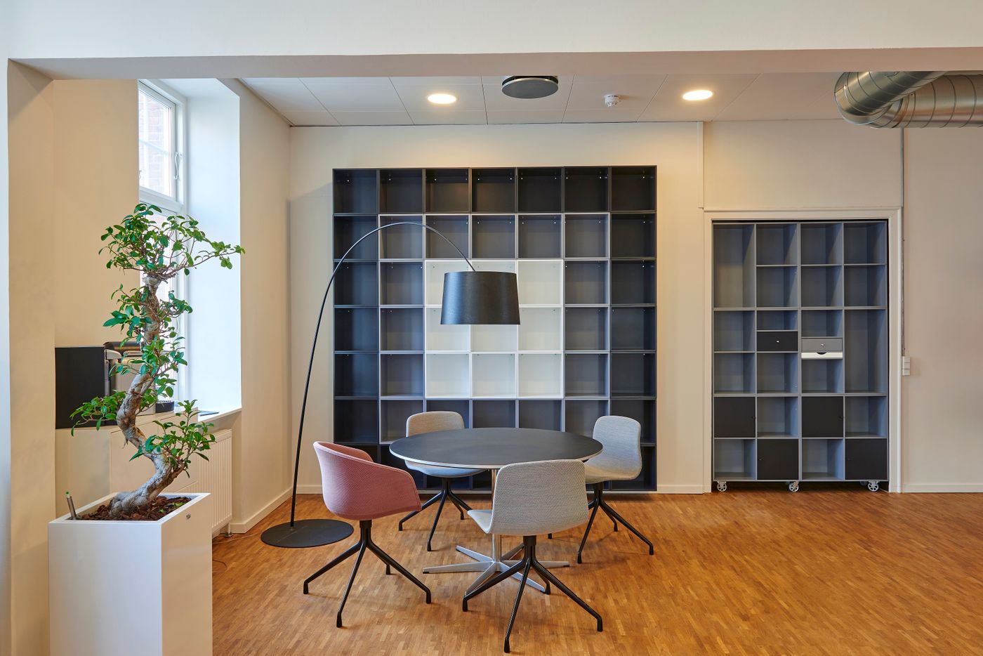 Professional office storage with filing furniture arranged beside a modern workspace