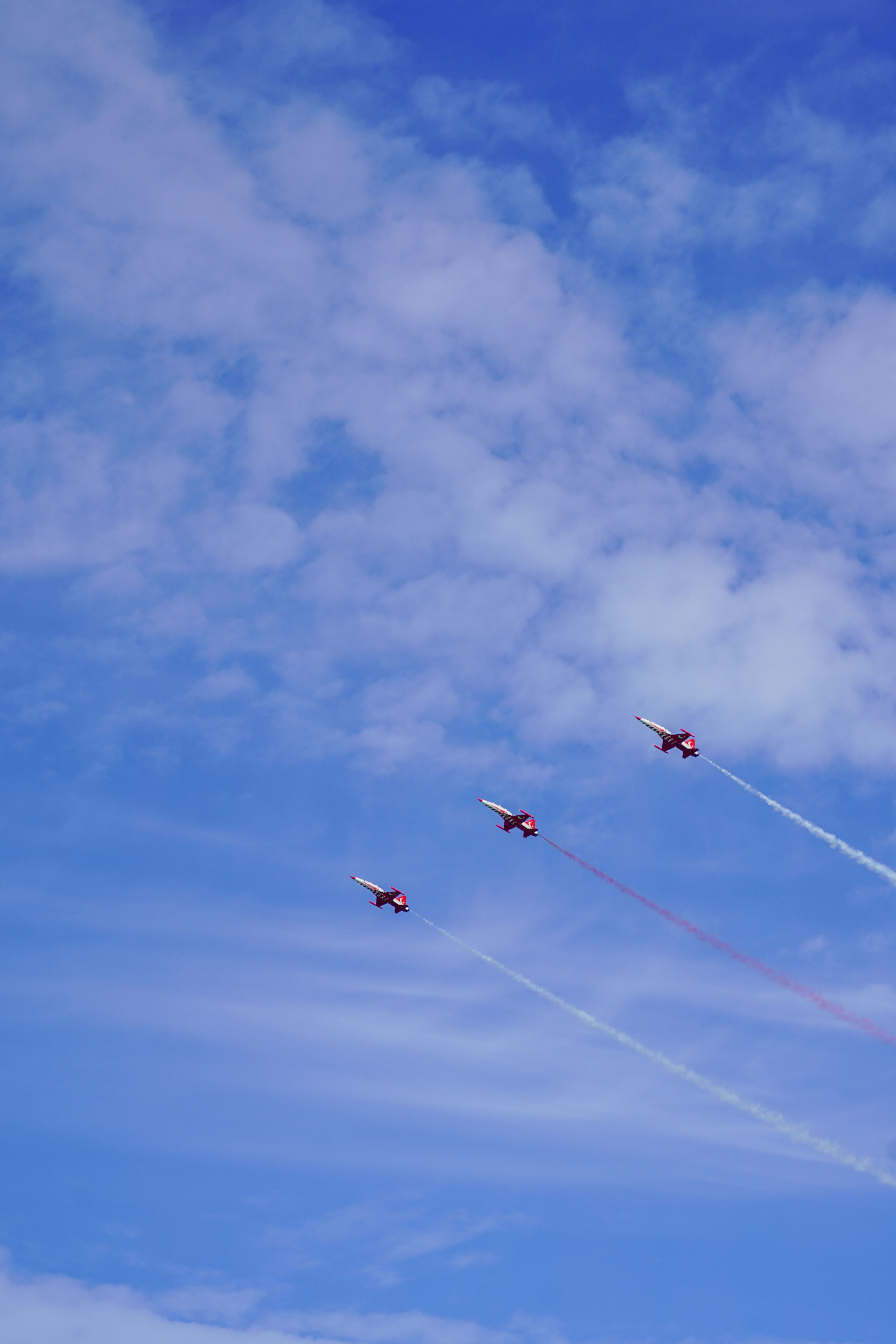 A group of airplanes flying in the sky · Free Stock Photo