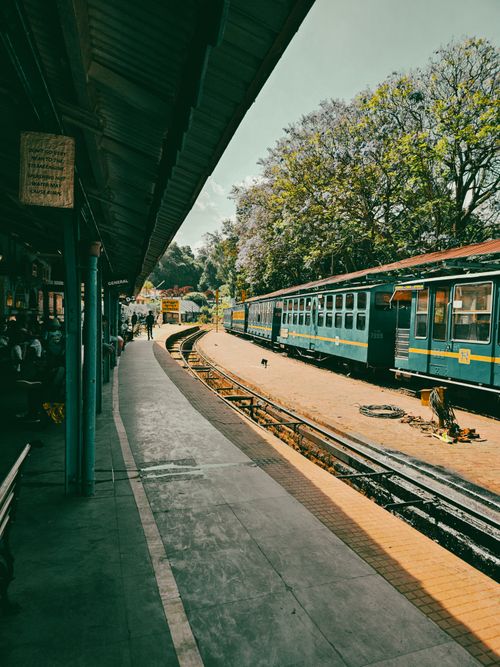 Free Charming view of a railway station in Coonoor, India, capturing vintage trains and lush surroundings. Stock Photo