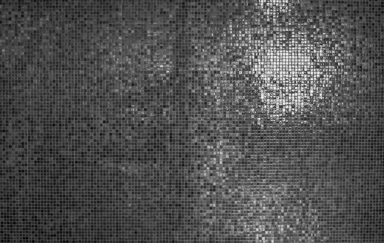 a detailed grayscale mosaic texture with reflective highlights perfect