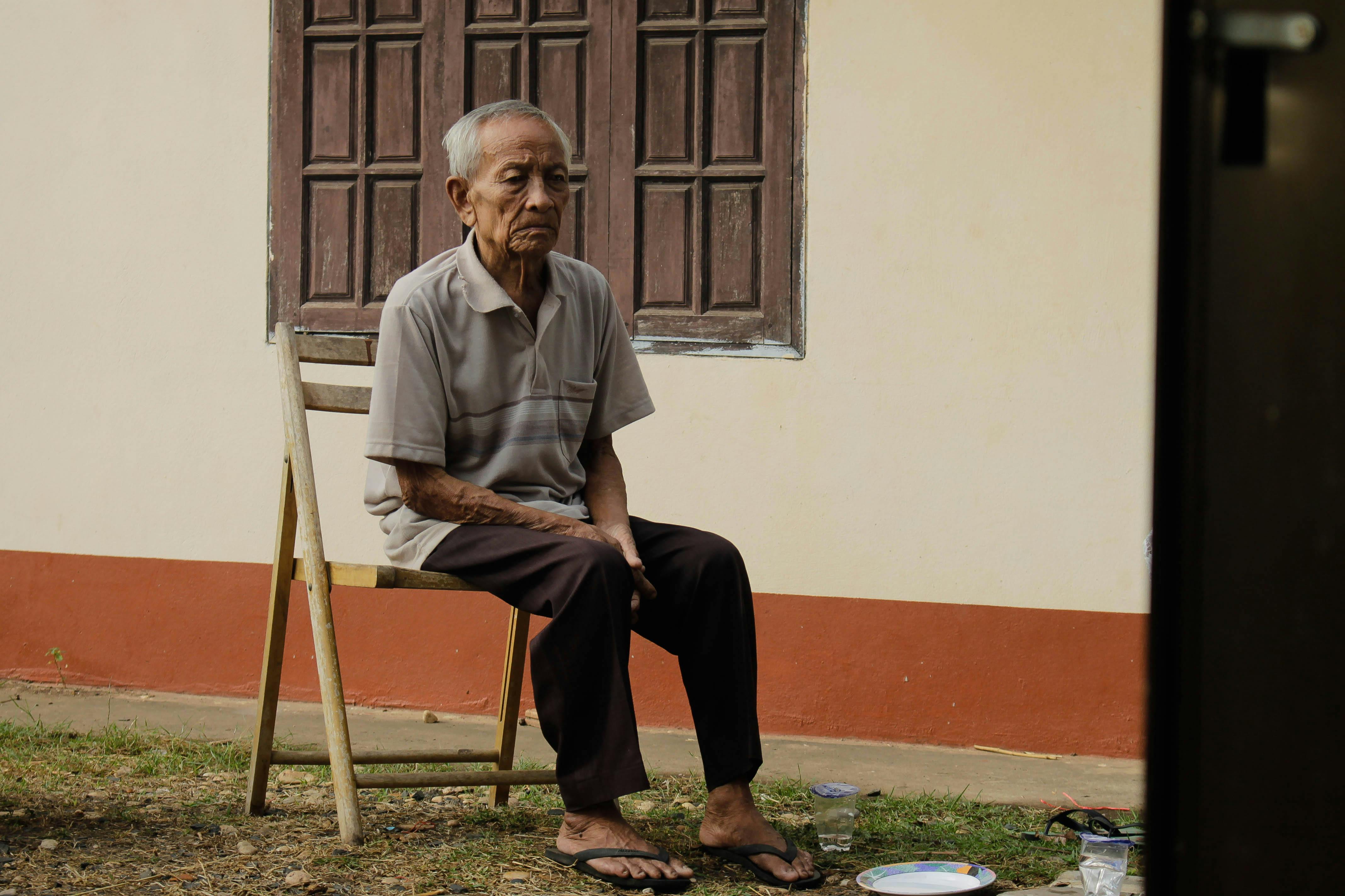 elderly man sitting