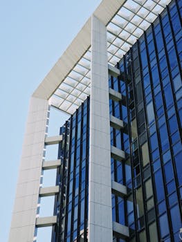 Close-up of a contemporary skyscraper with striking glass and steel architecture.