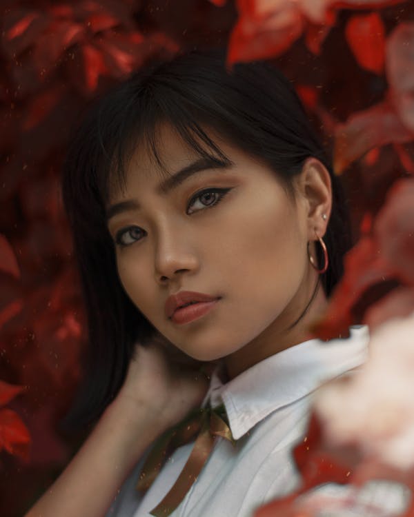 Close-Up Photo of Woman Wearing White Collared Top