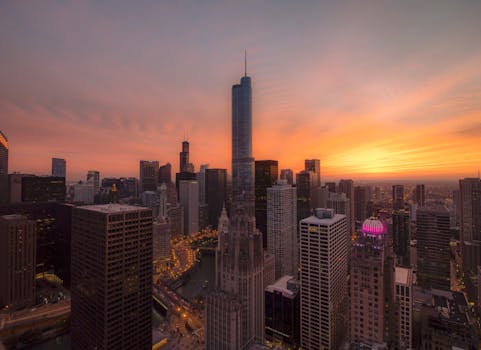 A breathtaking view of Chicago's skyline with a vibrant sunset, showcasing iconic skyscrapers.