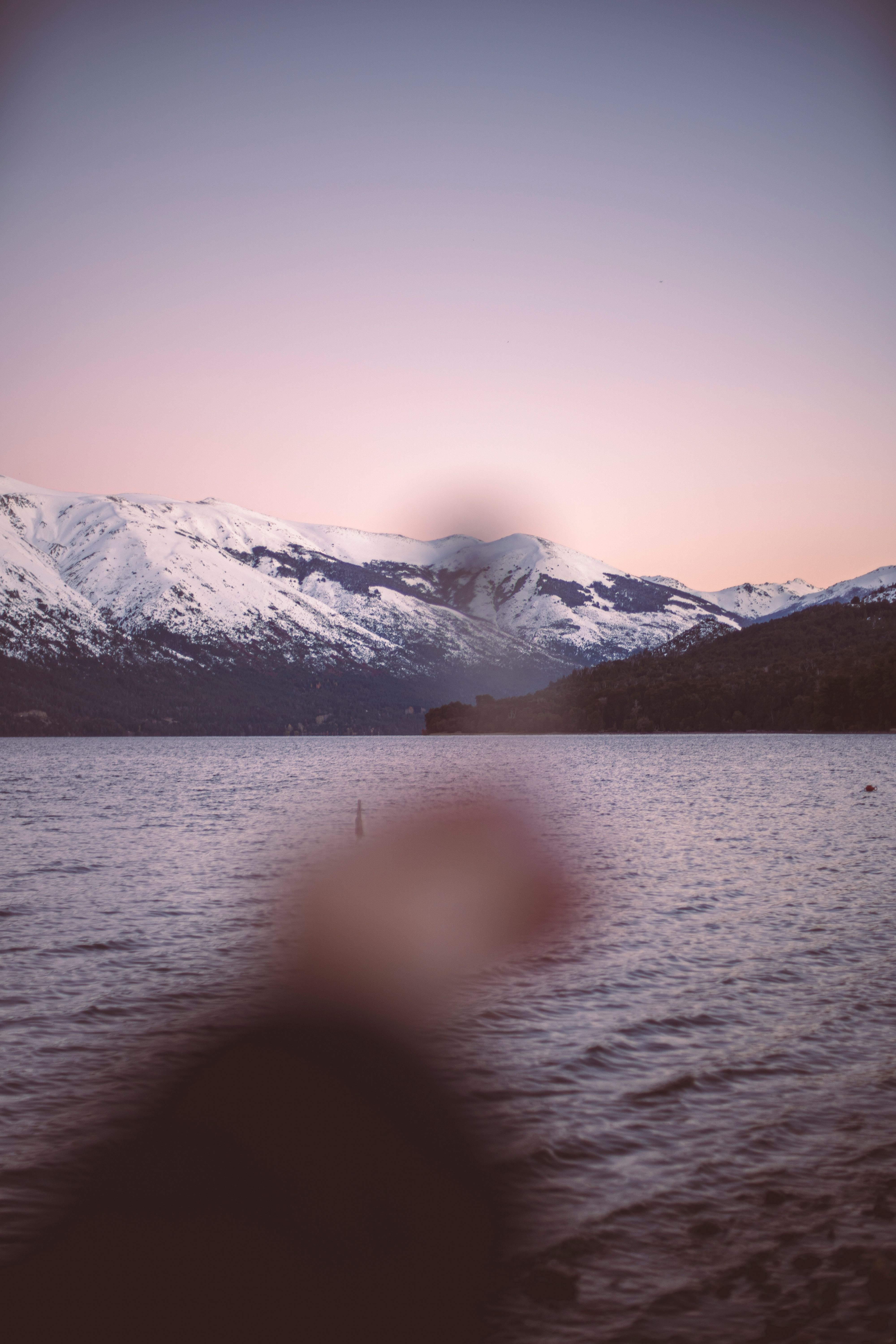 Stunning view of snowcapped mountains during sunset in Bariloche, Argentina.