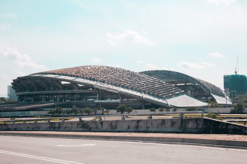 Free Outdoor view of Shah Alam Stadium showcasing its iconic lattice-style roof in Malaysia. Stock Photo
