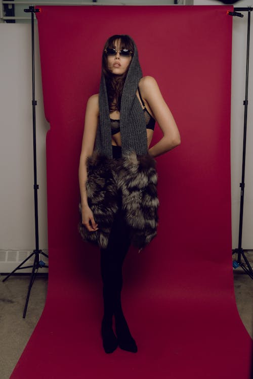 A woman in a fur coat posing for a photo