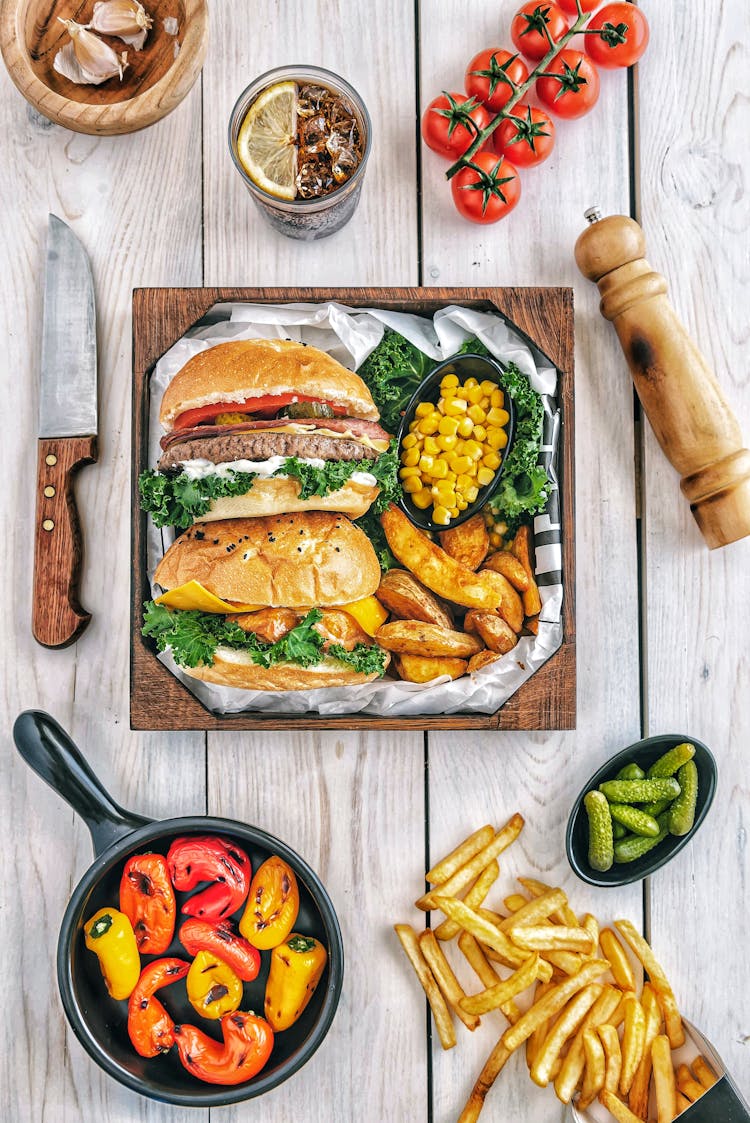 Burgers With Fries And Tomatoes