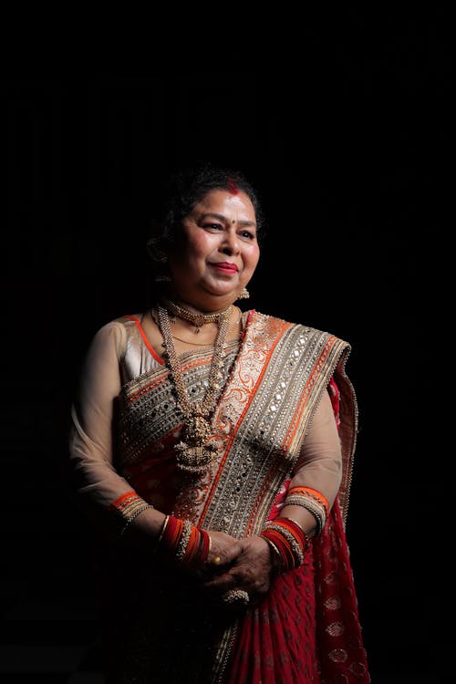 Serene Woman in Ornate Sari in Studio