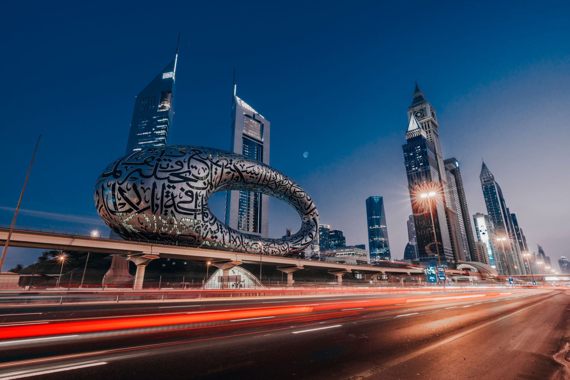 Dynamic view of the Museum of the Future in Dubai, showcasing modern architecture with city light tr