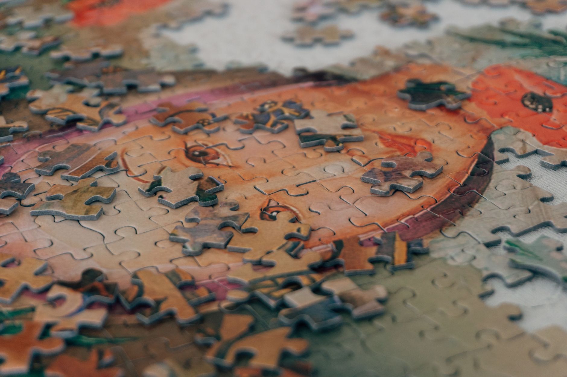 Detailed close-up of colorful jigsaw puzzle pieces forming an eye-catching pattern.