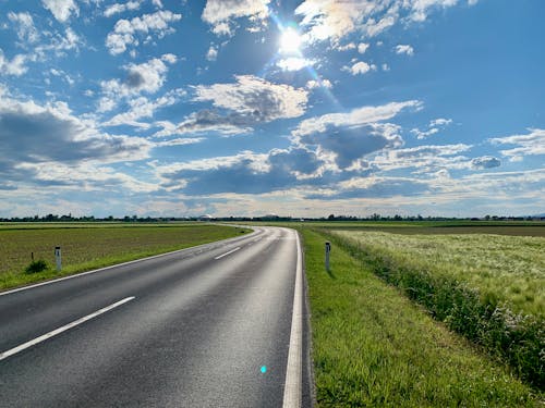 Ingyenes stockfotó aszfaltúton, felhős ég, mező témában