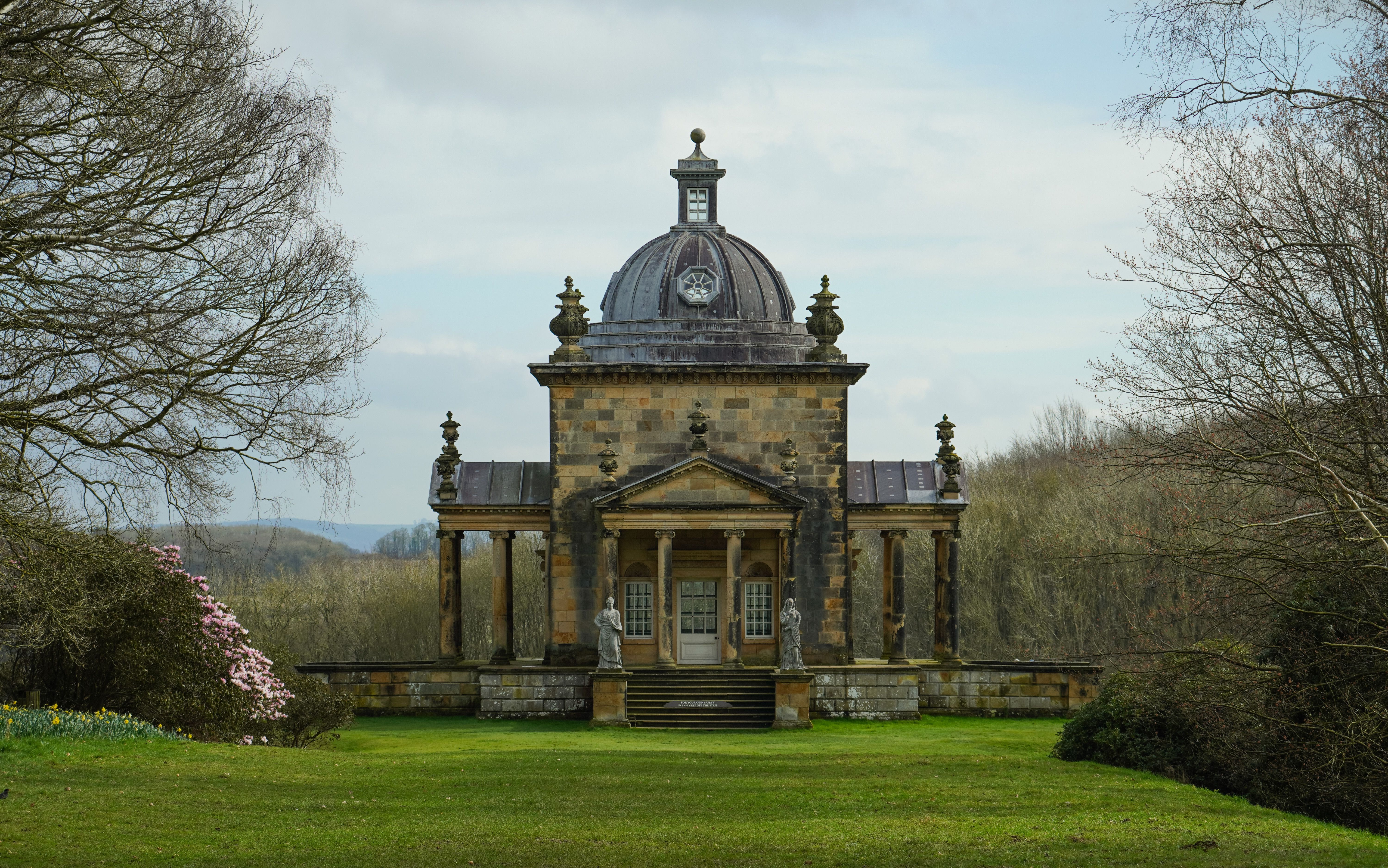 Explore the historic Temple of the Four Winds set in the scenic grounds of Castle Howard, England.