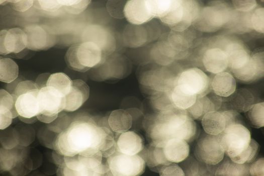 A close-up of abstract bokeh lights creating a warm, glowing pattern.