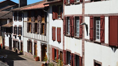 A street with many buildings and a red door