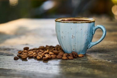 Free Blue Cup Near Coffee Beans Stock Photo