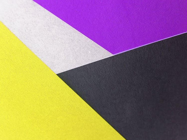 Yellow, Black And Purple Colored Papers