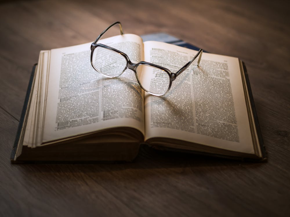 Eyeglasses on Open Book