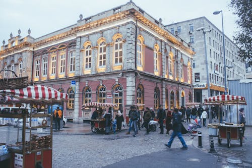 Photo of People Walking Near Buildings