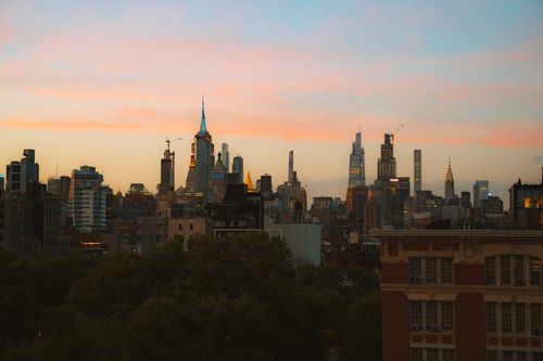 Free Stunning view of New York City's iconic skyline during twilight with colorful sky. Stock Photo