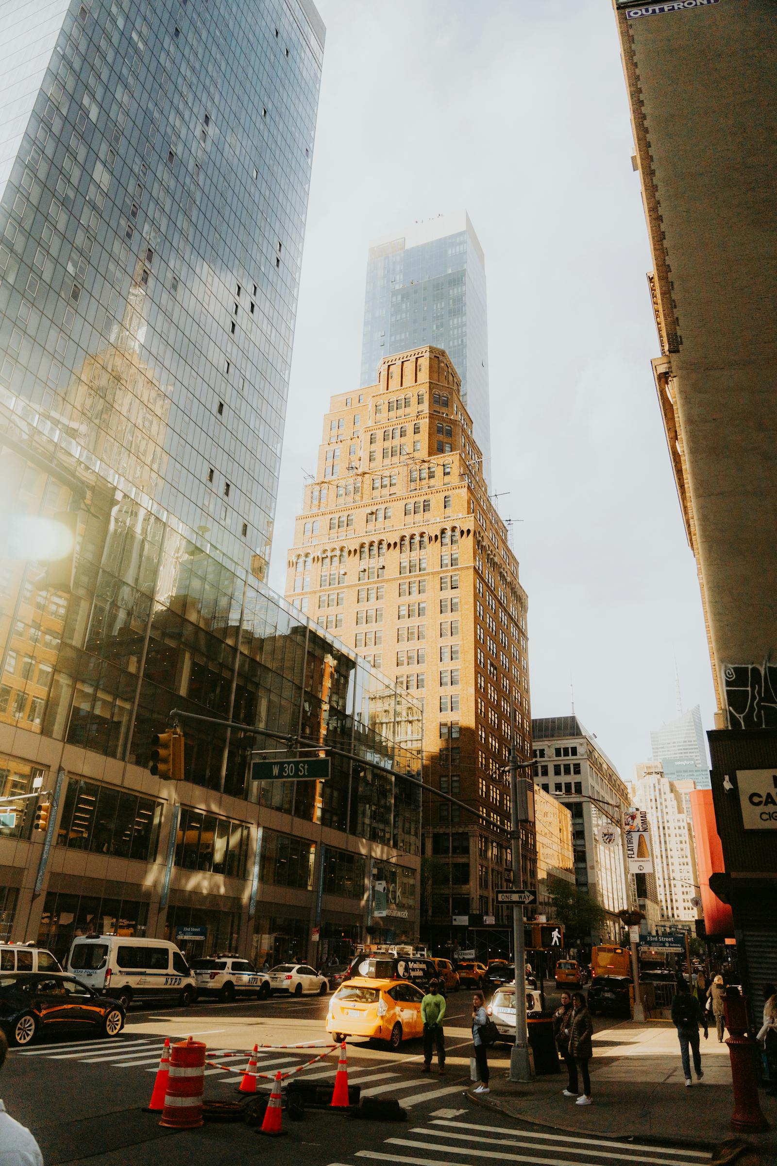 Vehicles on Road Between High-rise Buildings · Free Stock Photo