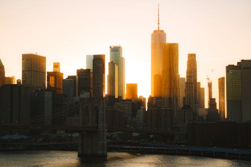 The sun is setting over the city skyline